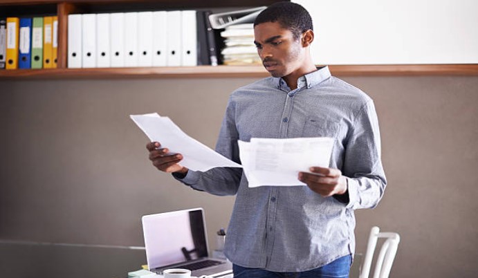 a man reading papers